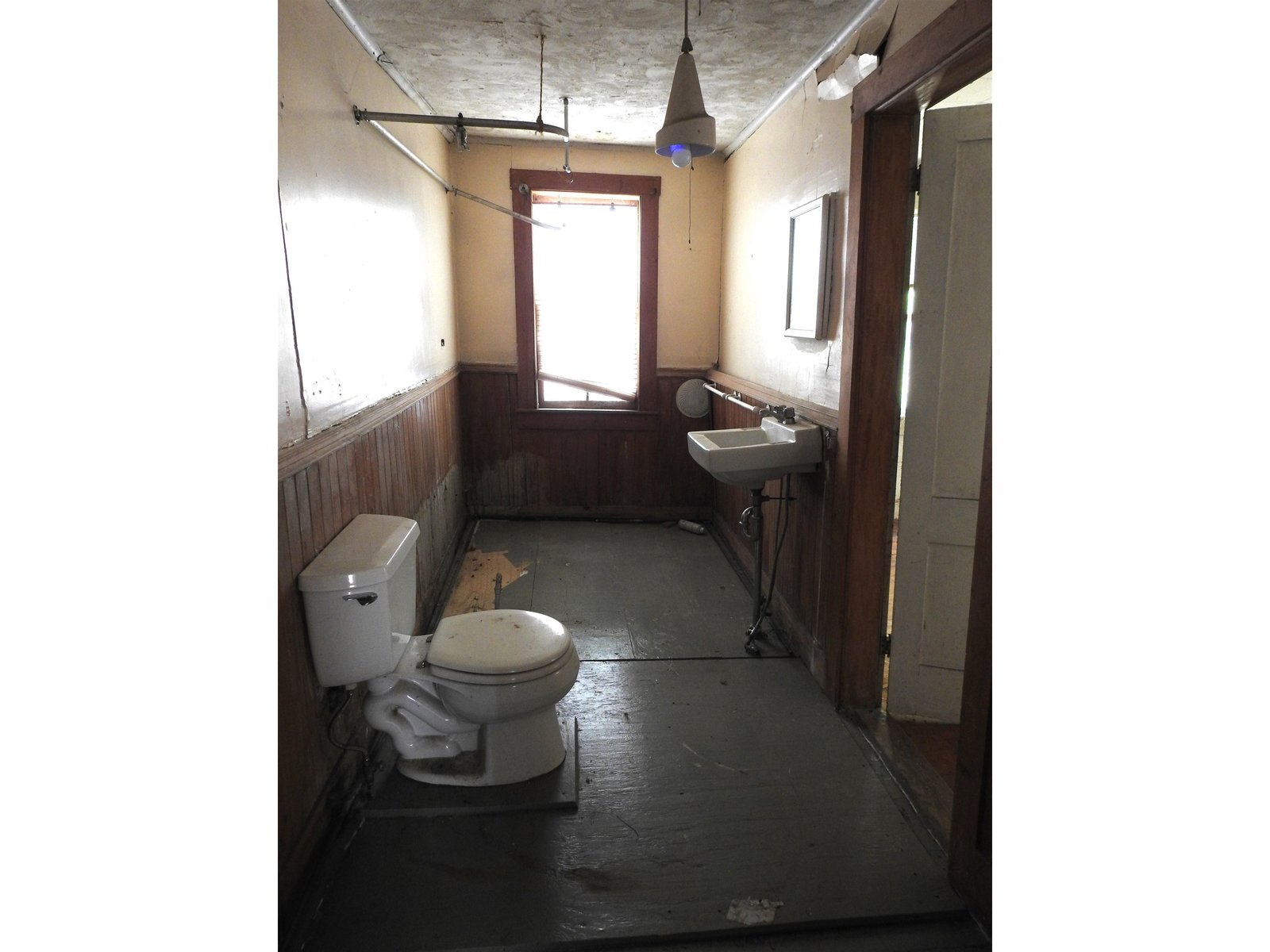 Bathroom with door to right accessing primary bedroom