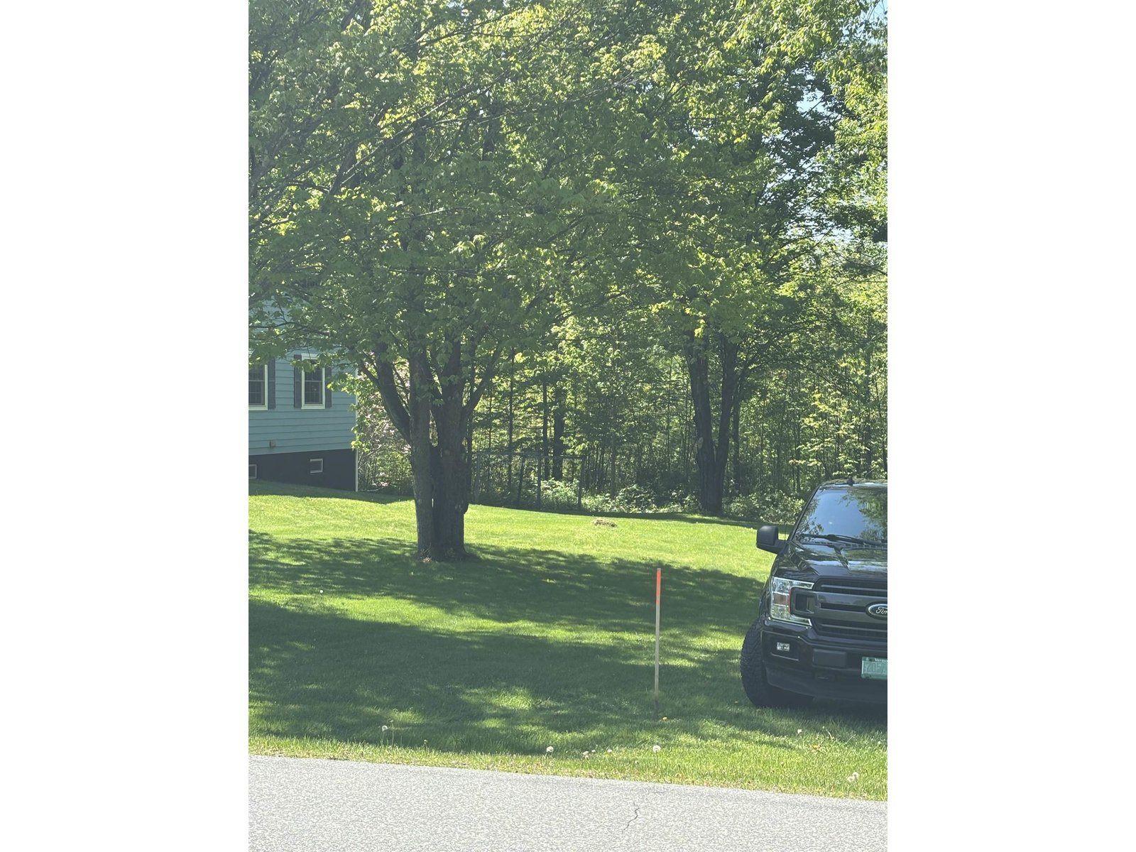 Photo Showing Car Leaving Property Right-Of-Way On To & Next To 620 Harrel Street