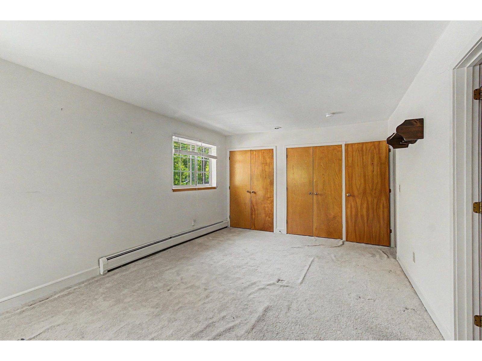 Opposite perspective of the Primary bedroom with good natural light.