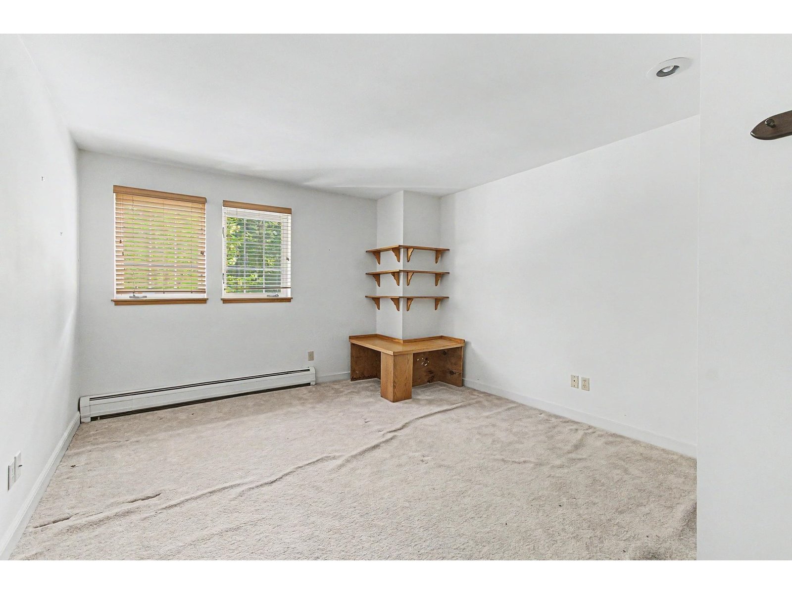 Bedroom #2 on the upper level.  Carpet needs to be stretched or replaced.