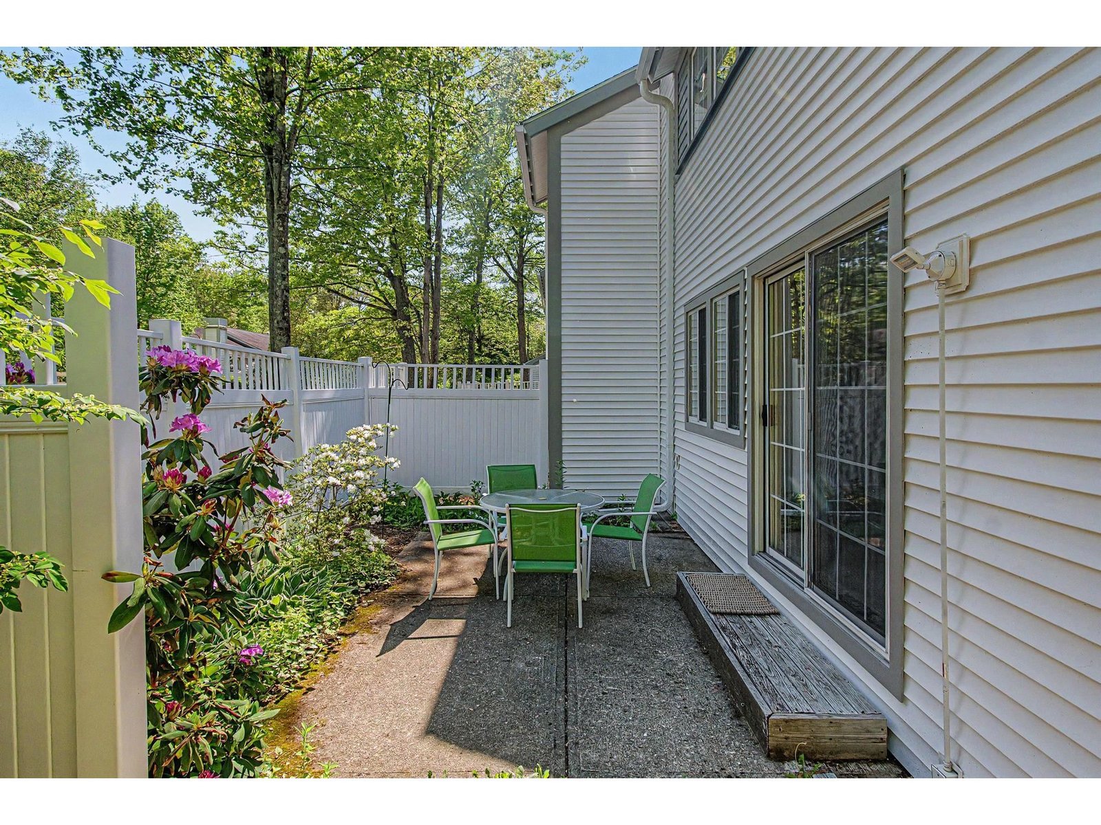 Patio area with private garden and secondary entry.