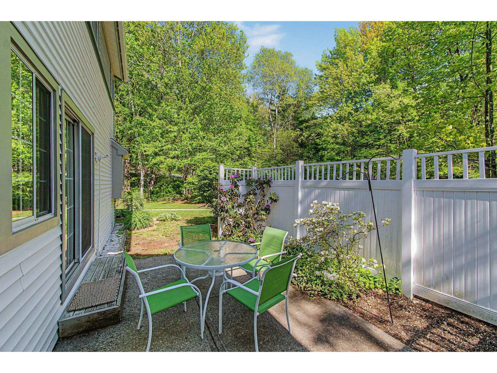 Side patio and secondary entry.