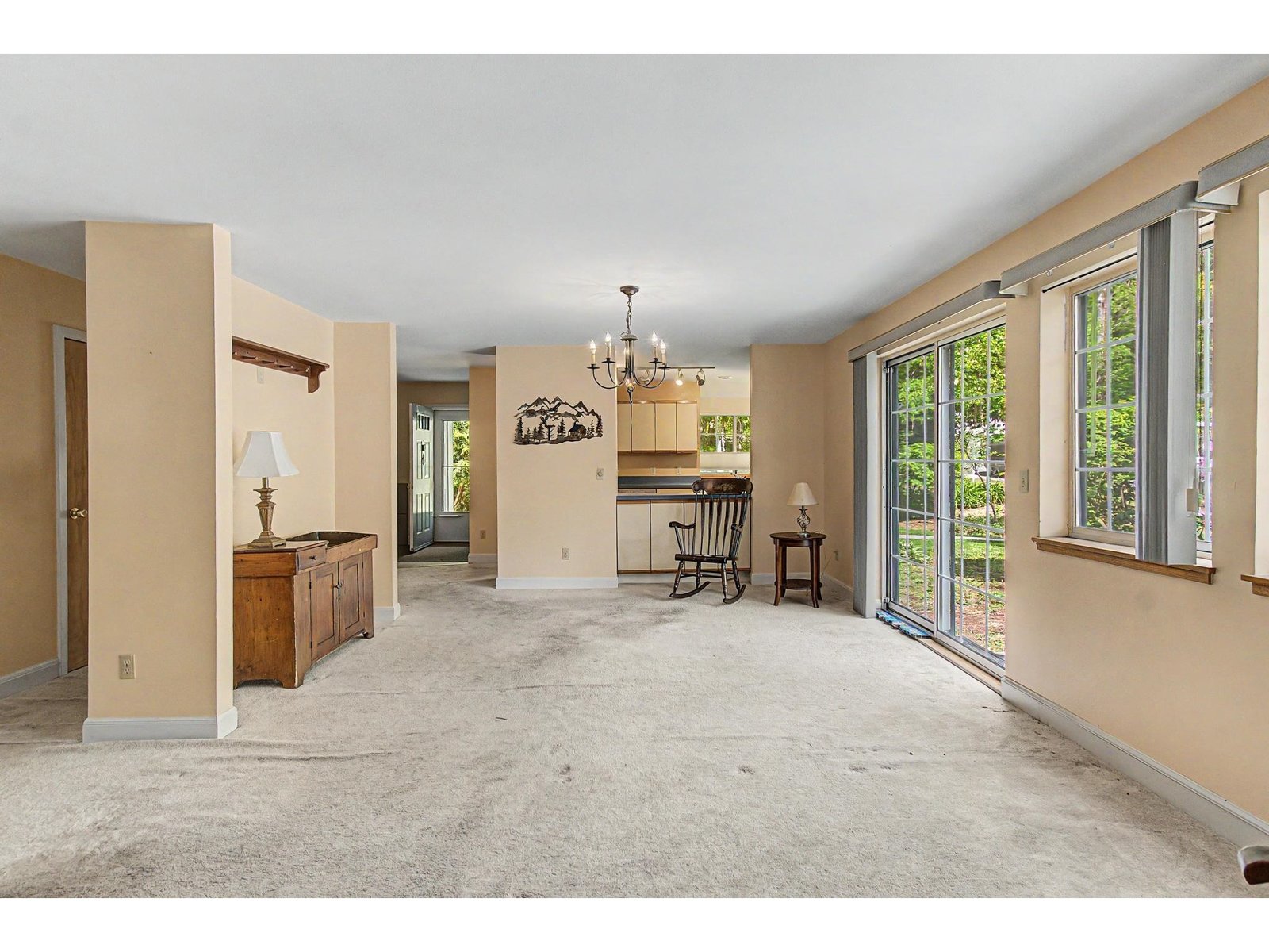 Open floorplan with living/ dining window to kitchen.