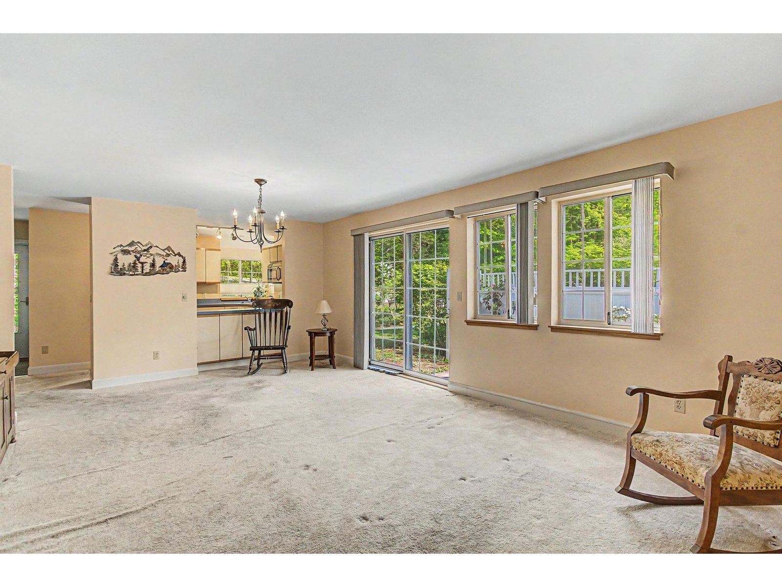 Another perspective of the main living area with a slider to access the patio.
