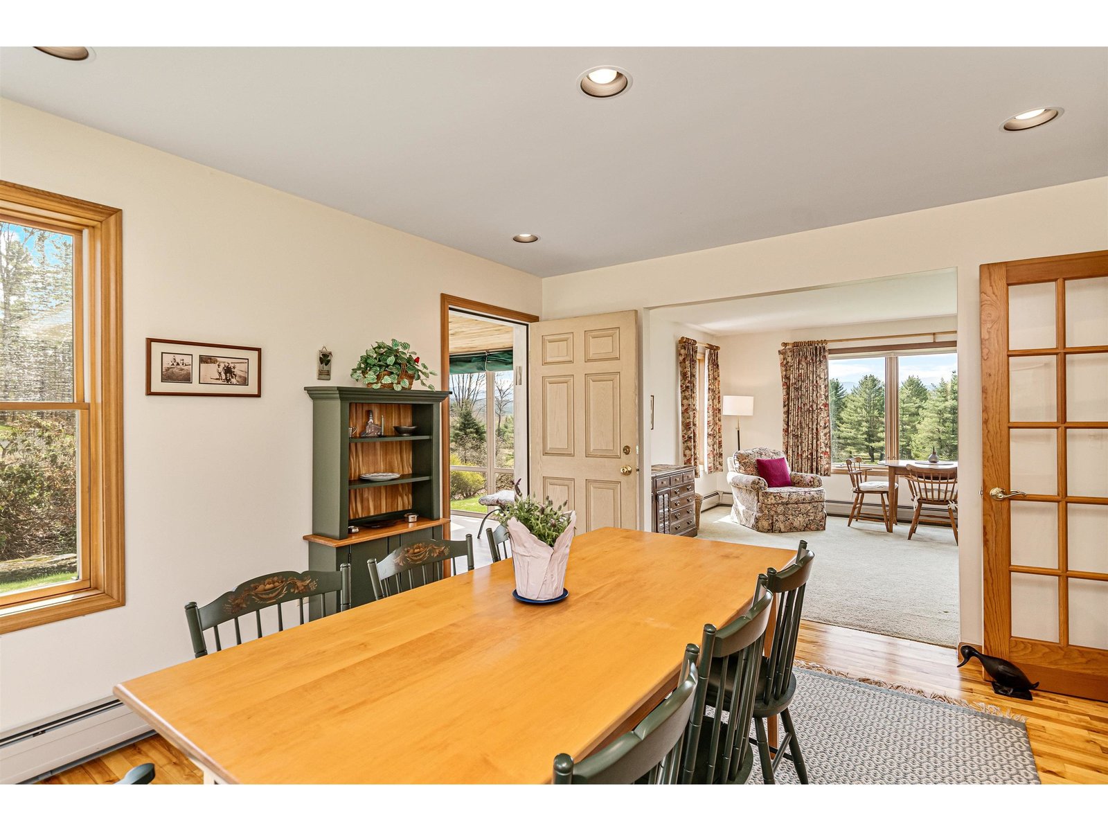 Located between kitchen, living room and screened in porch