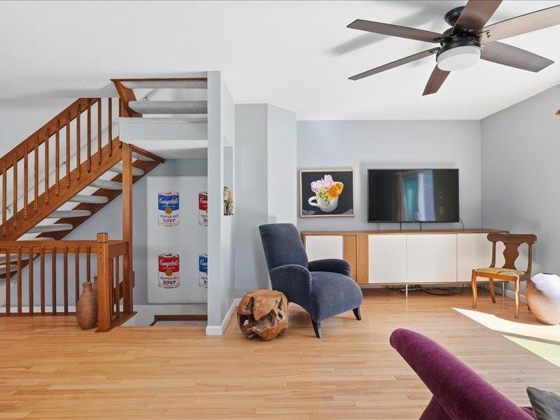 Living Room and Stairs Down to Lower Level