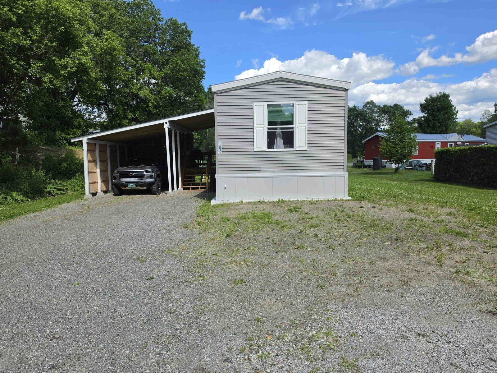 Home and carport with parking lot
