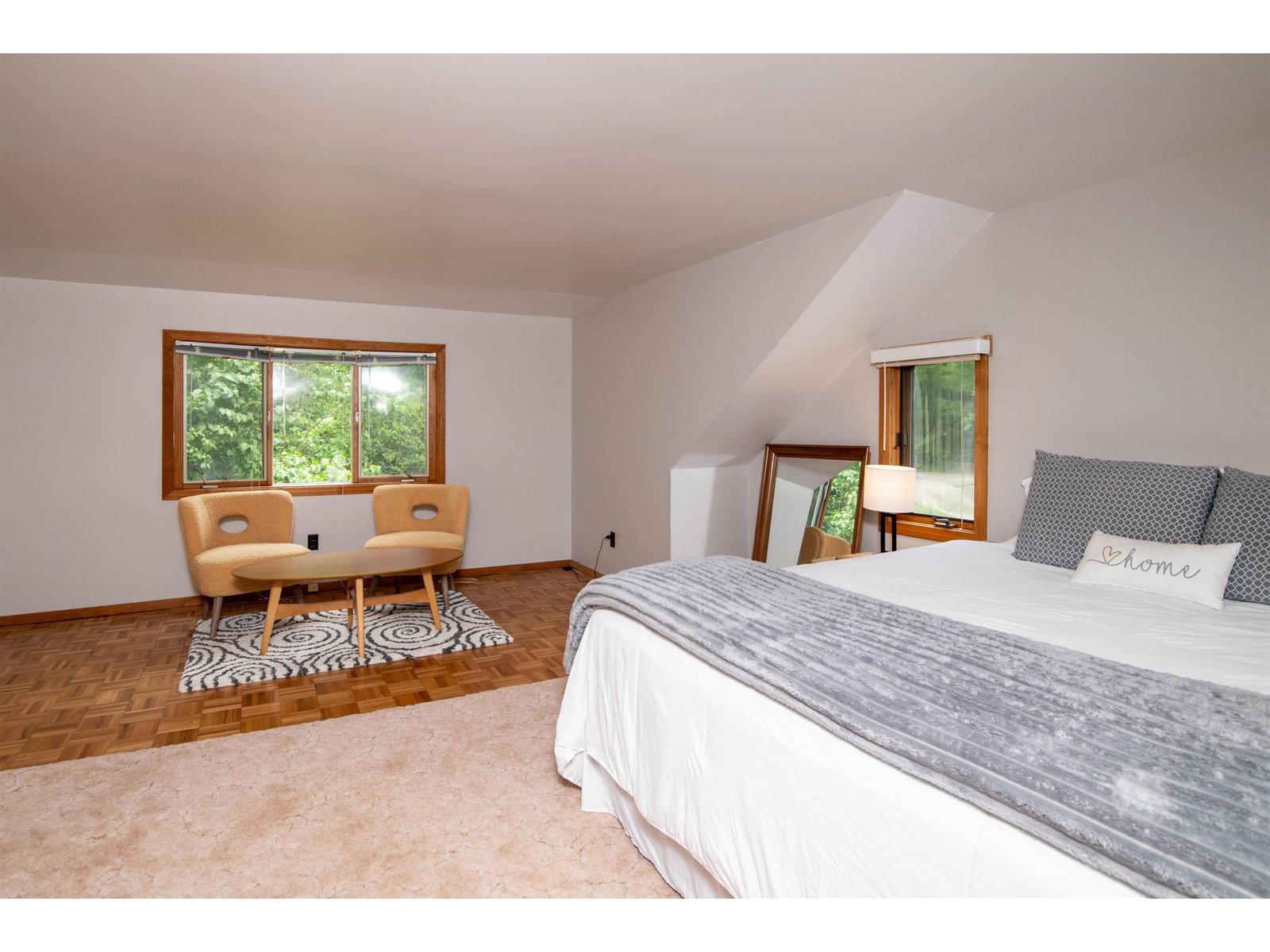 Spacious primary bedroom with sitting area