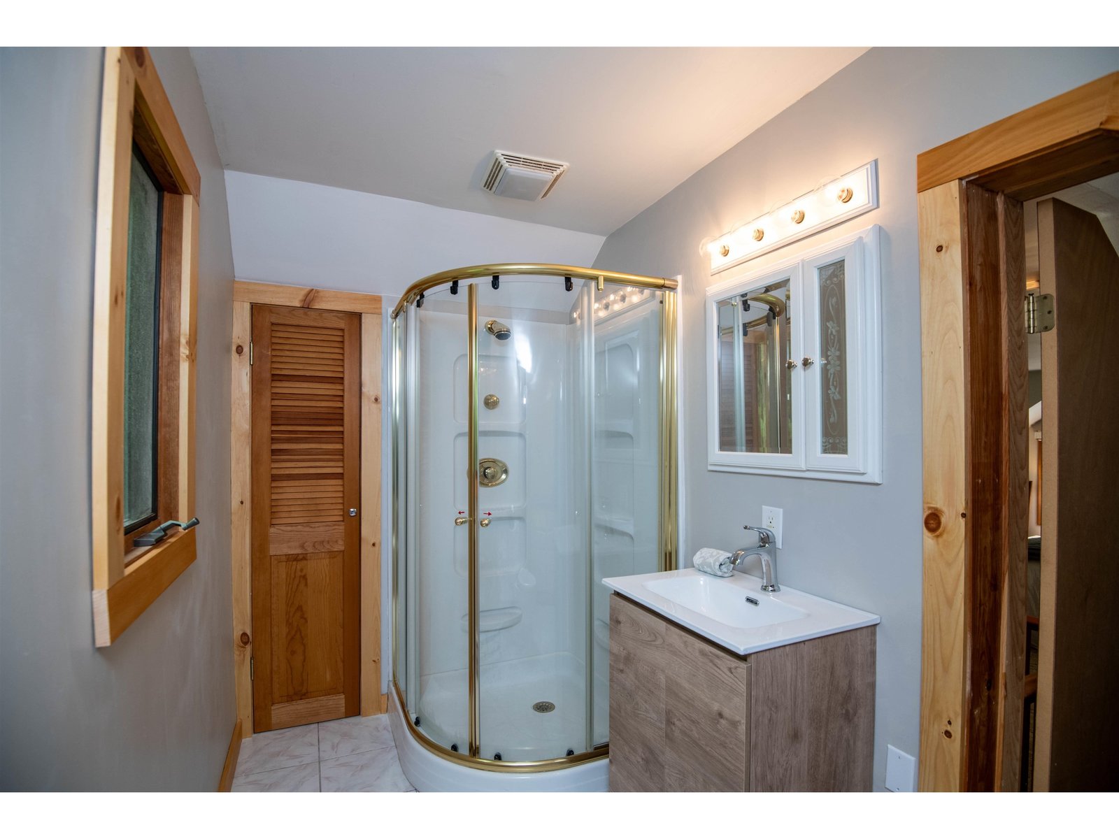 Primary bath with glass enclosed shower