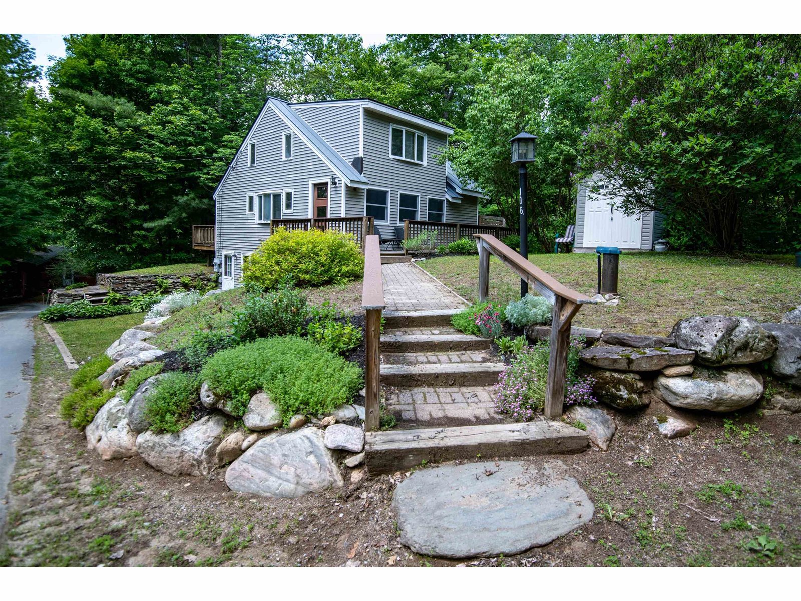 Welcoming walkway leading to entry and deck areas