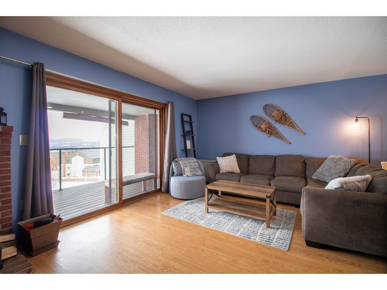 Living room with sliders to the deck