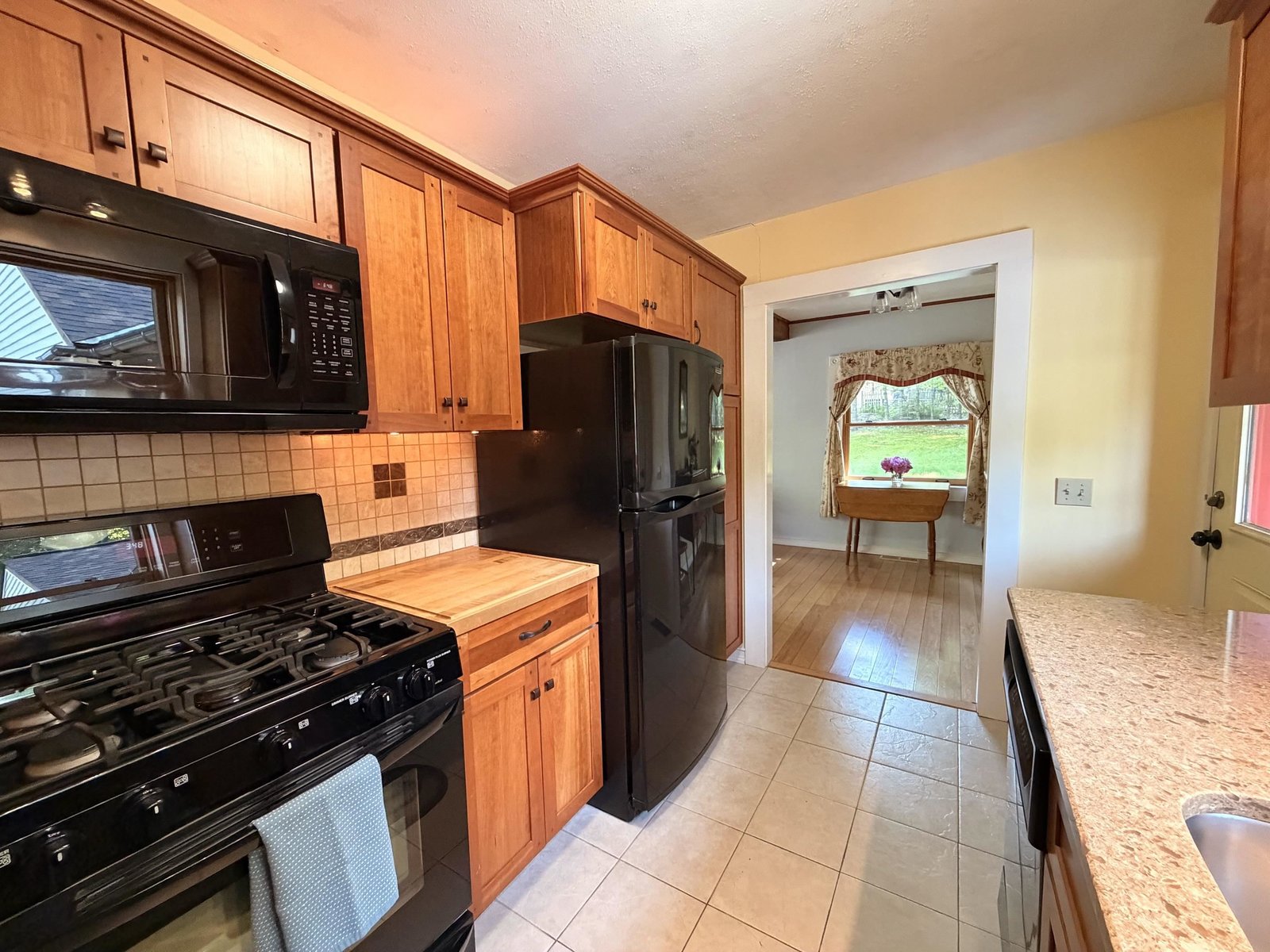 Cherry cabinets- view toward dining area