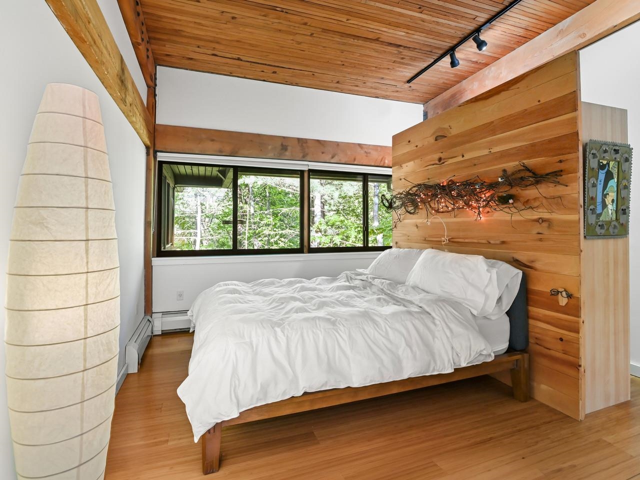 Bedroom with wood accent wall