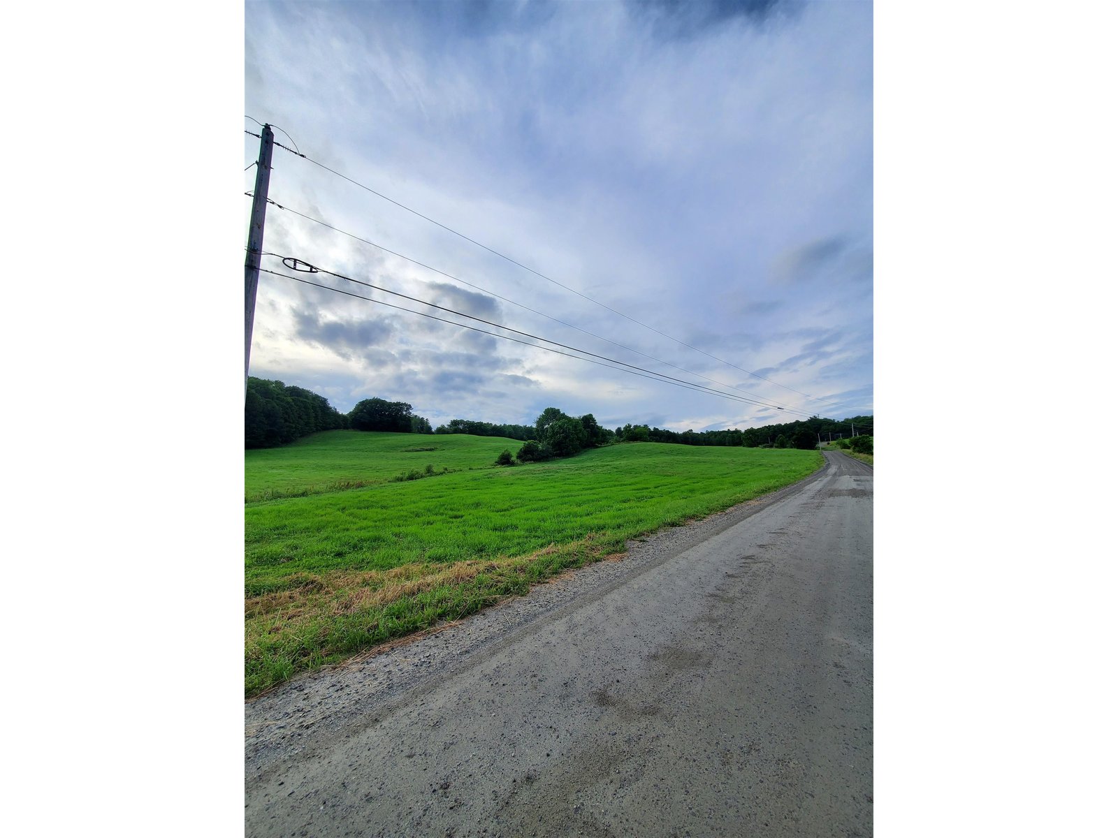 Land freshly hayed looking north