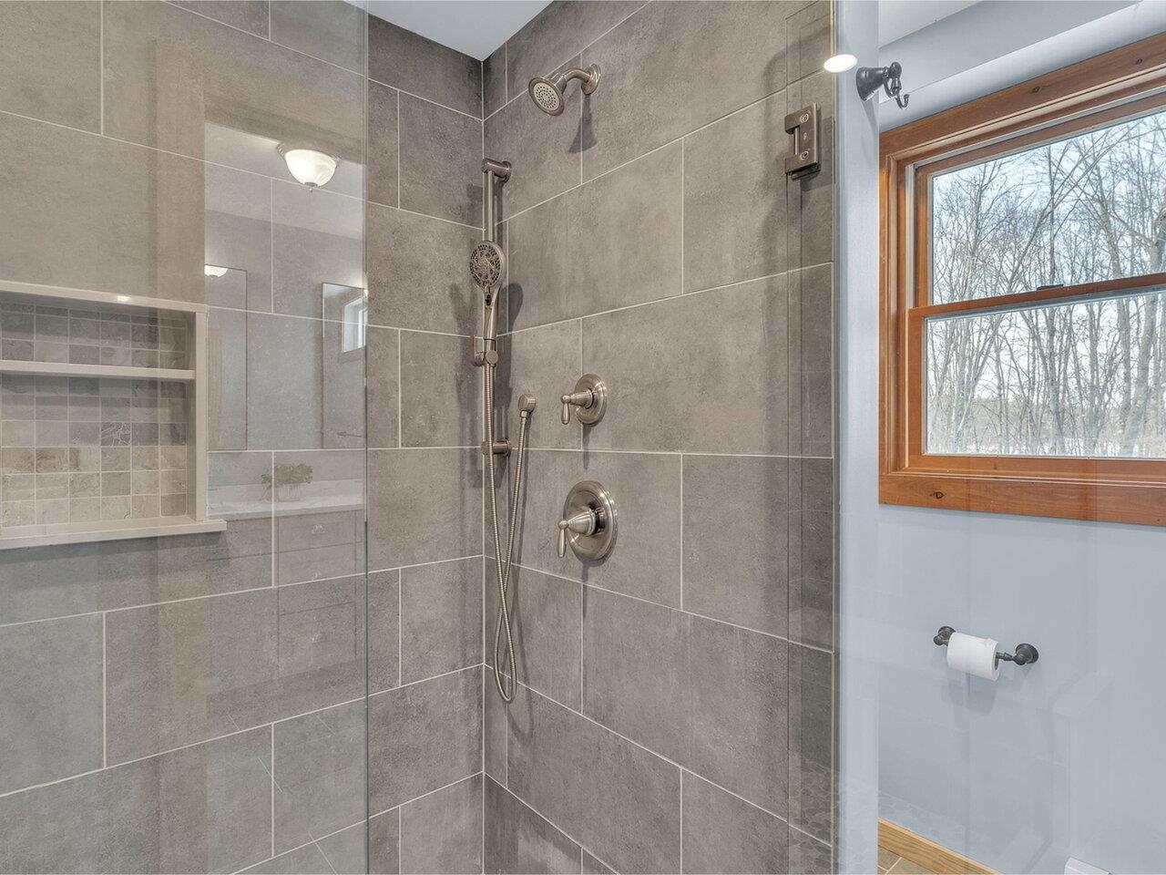 Tiled shower with glass door