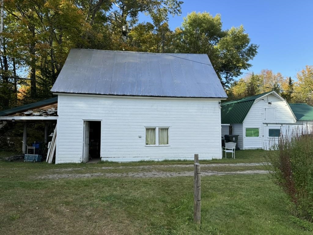 The barn with a newly painted roof