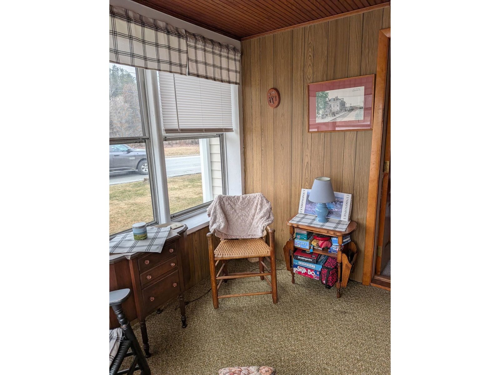 Sunroom off living room facing the road