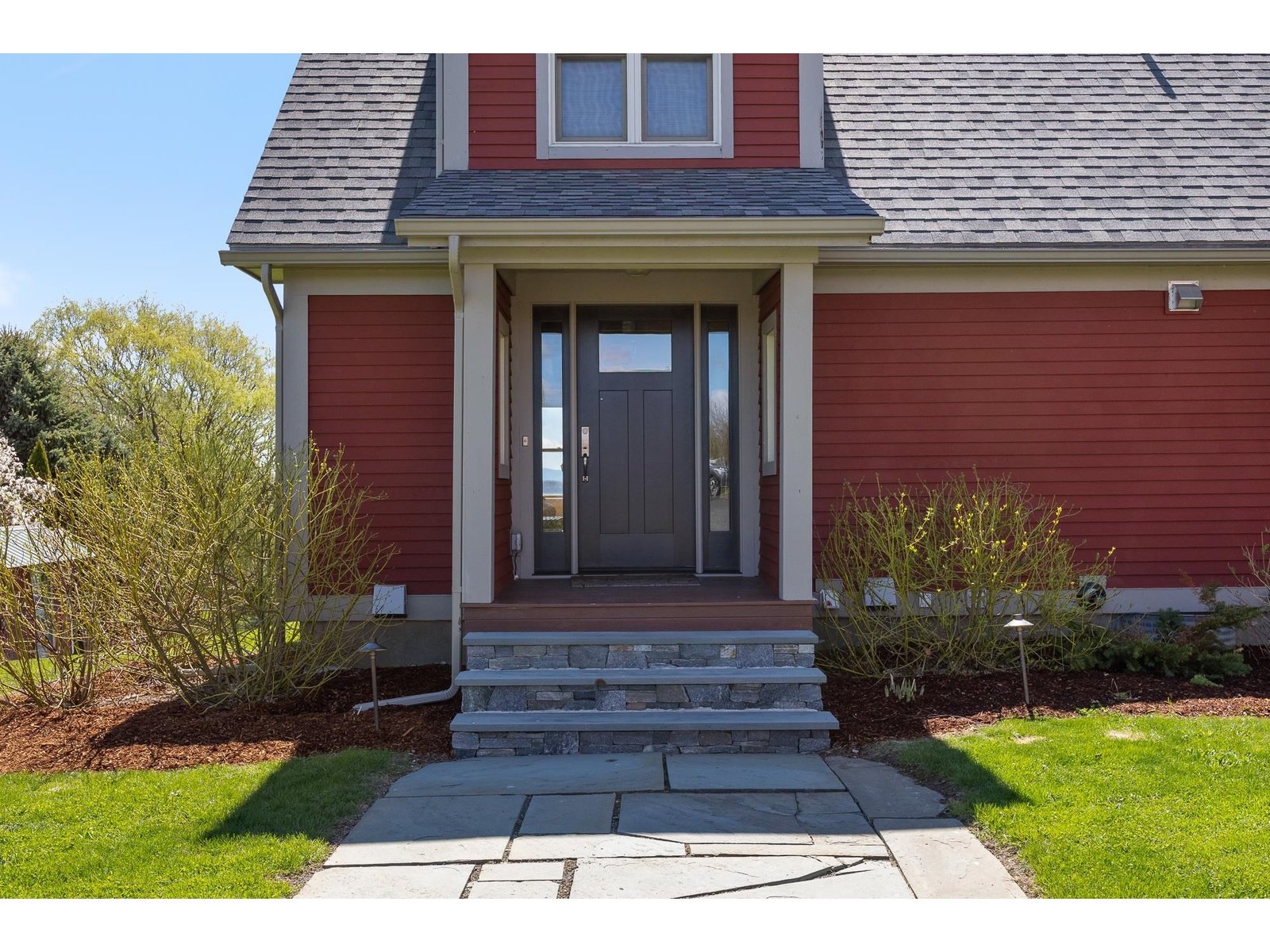 Main entrance with brand new high end custom door from Doors by Brownell