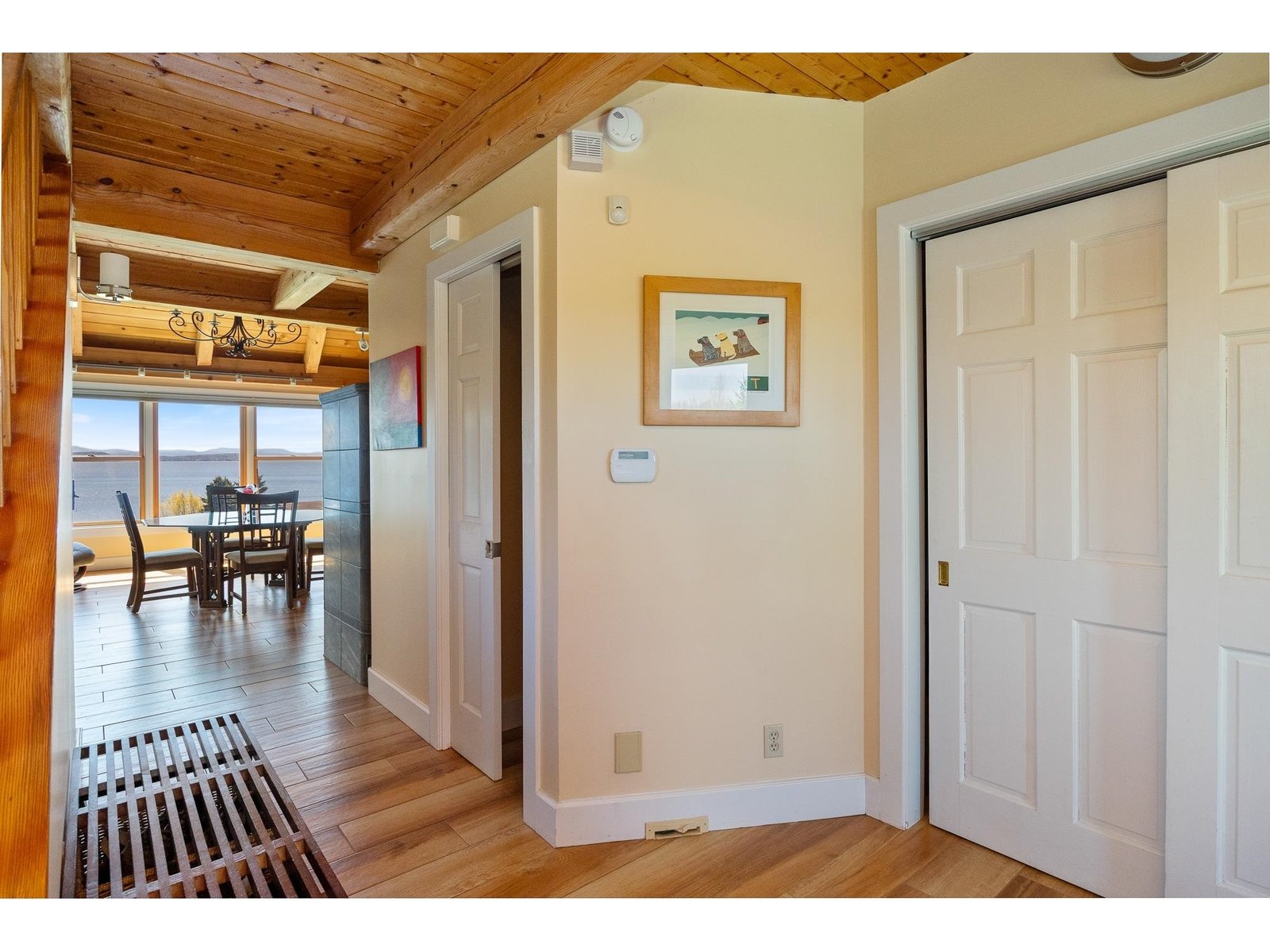 Entryway to powder room and dining room