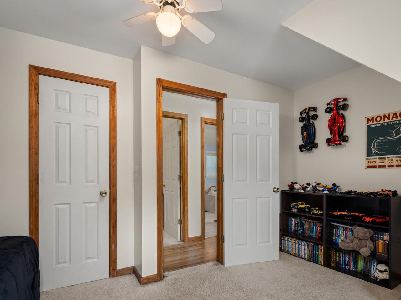 Carpeted bedroom with closet