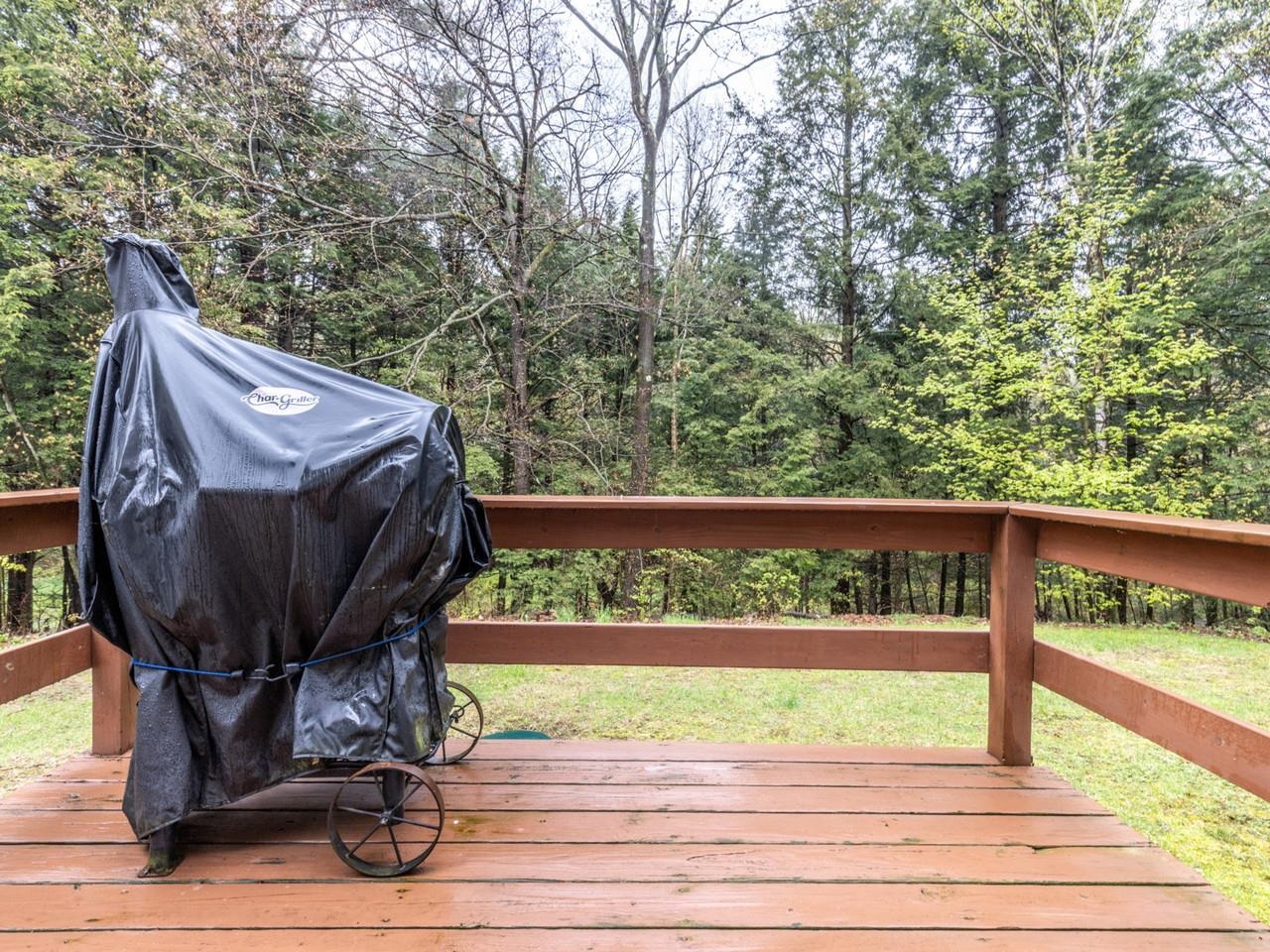 Deck overlooks Backyard