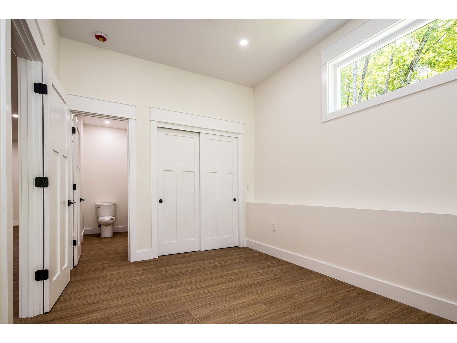 Lower level primary with 1/2 bath