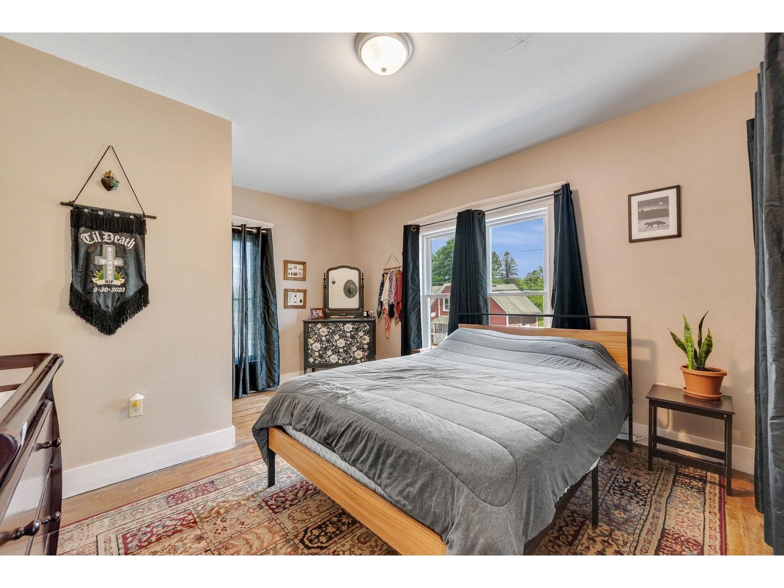 Primary bedroom with attached half bath and walk in closet