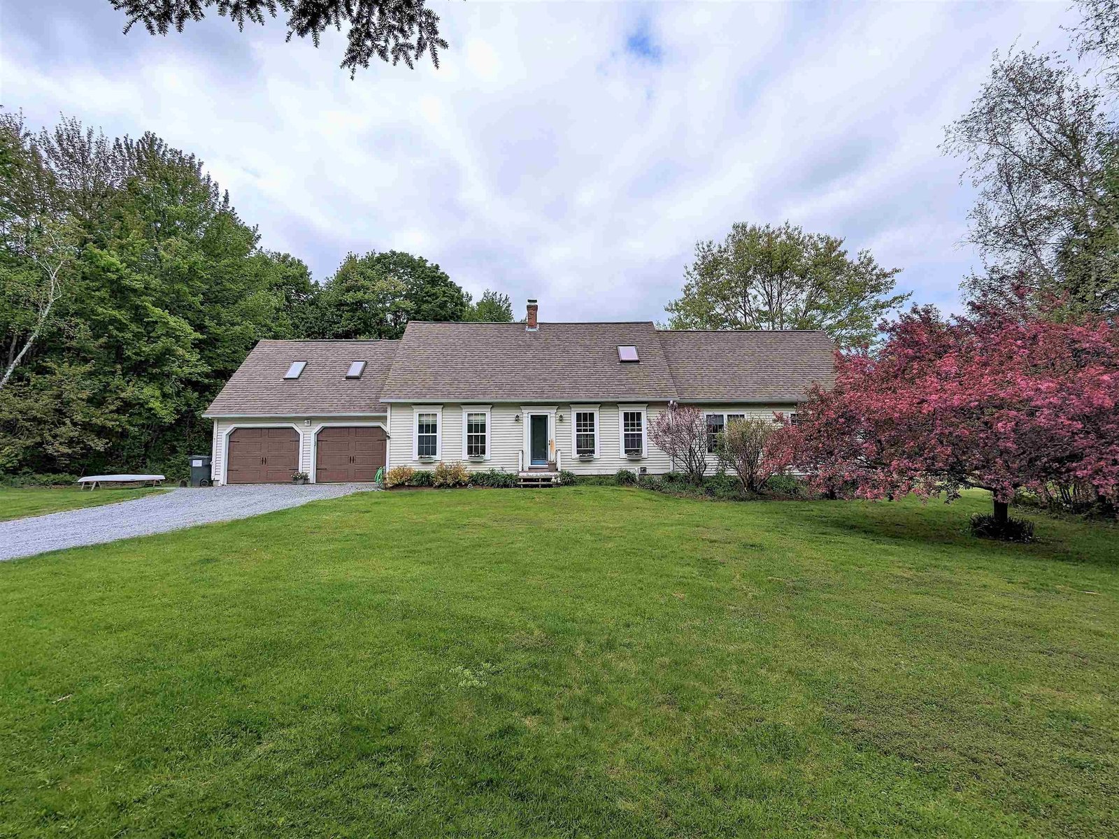 Expansive Cape with Brand New Garage Doors