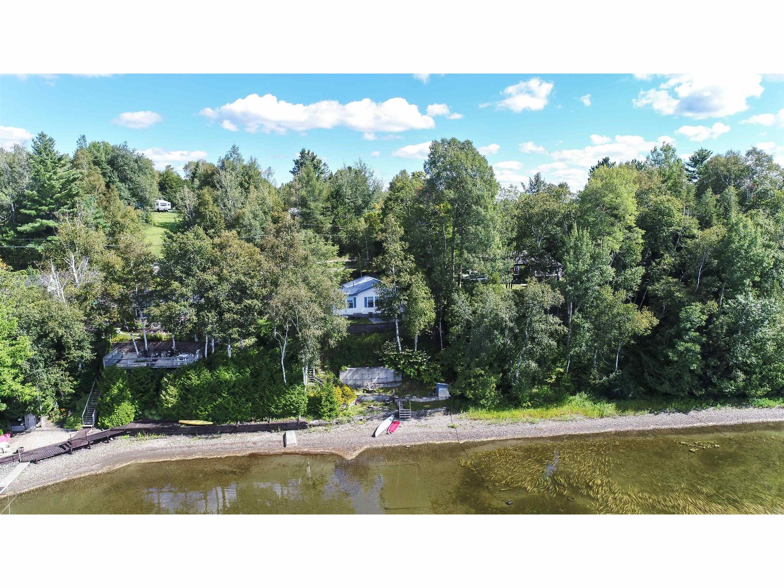 From the Lake the Cottage is Tucked into the Trees