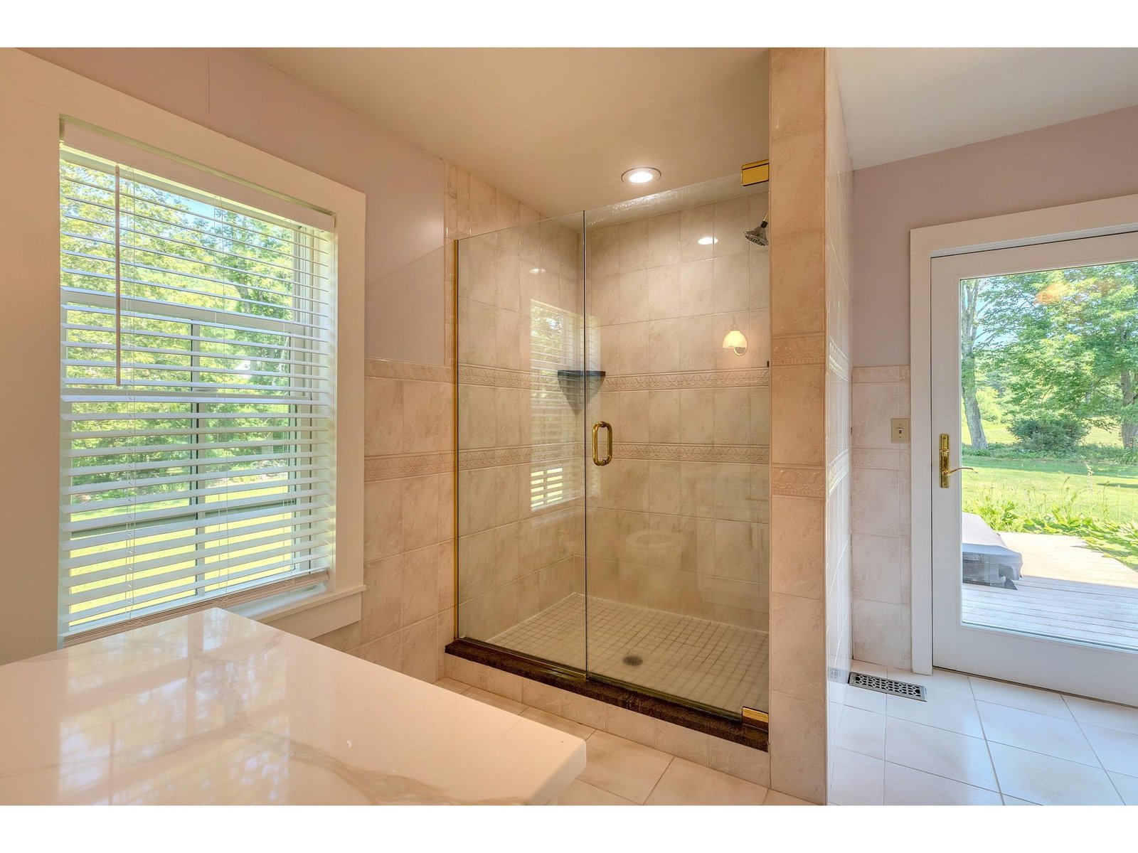 Primary bathroom with access to back deck