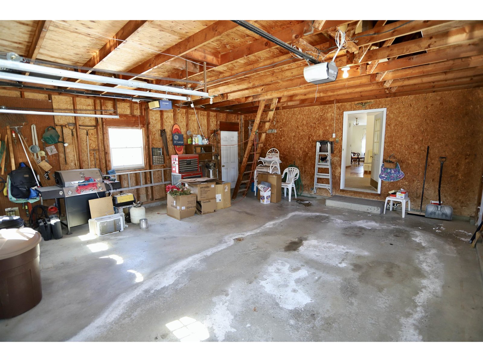 Doors to Front, Back, Kitchen/Dining Off Garage
