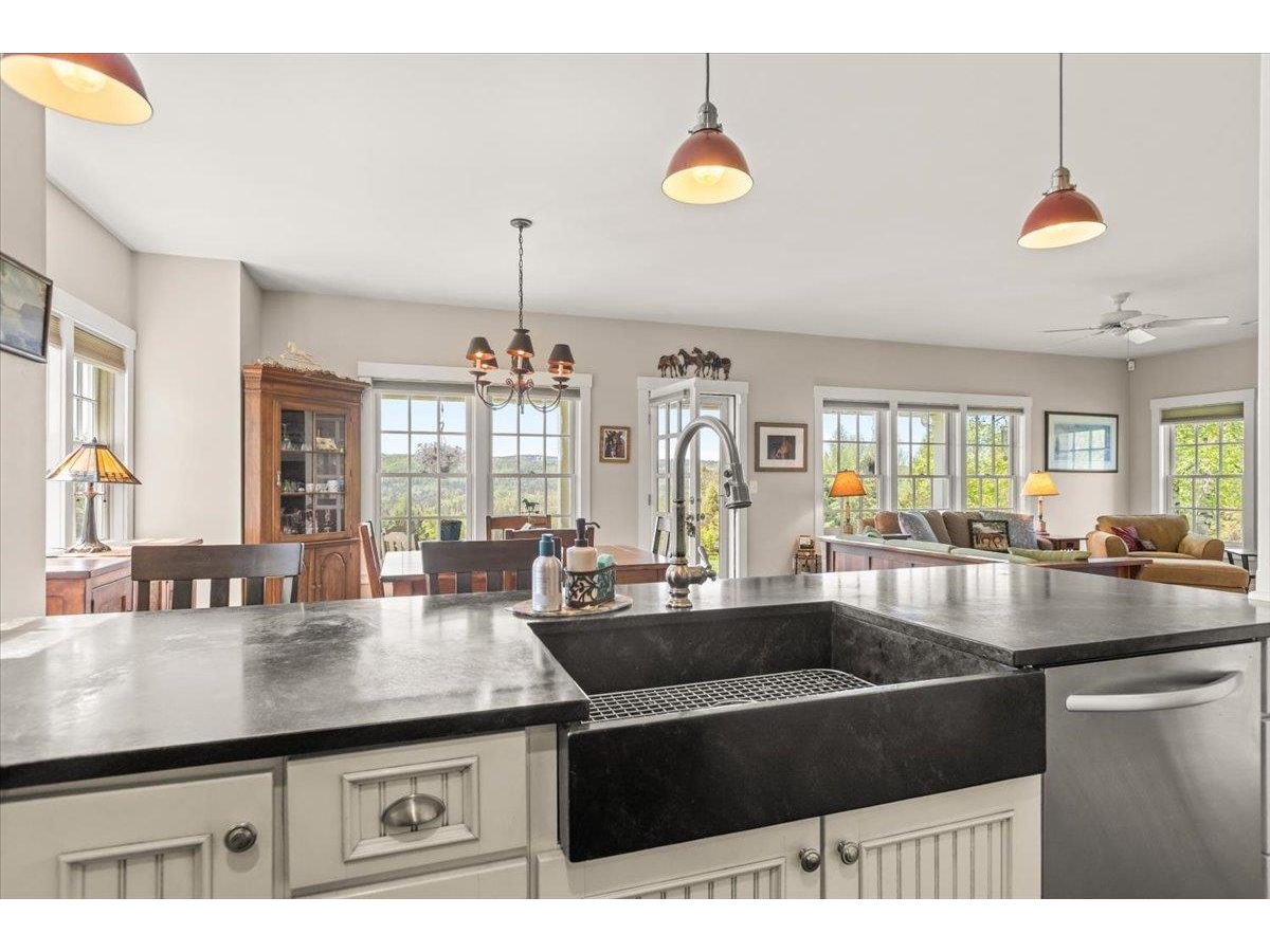 Breakfast bar, open floor plan to dining room/living room