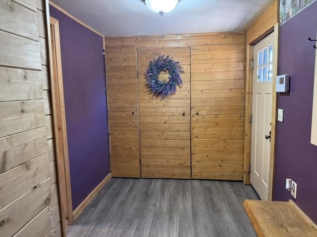 Entryway with built in closet spaces