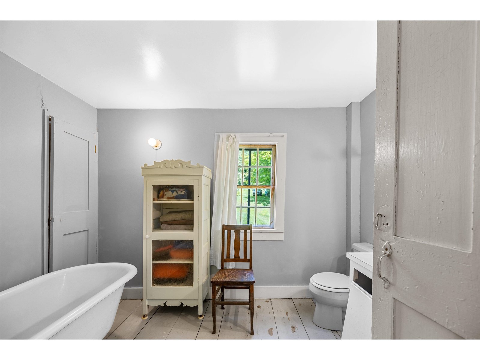 1st floor with old fashion tub, a fitting complement to this farmhouse
