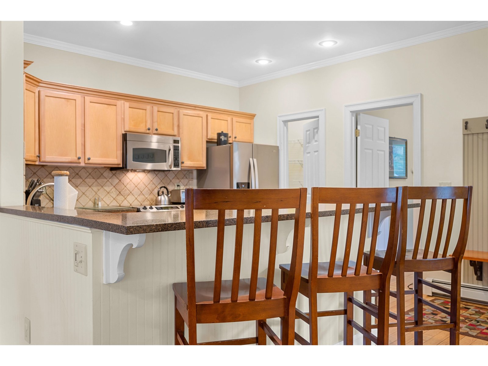 Kitchen Breakfast Bar with Pantry, and Door to the Den