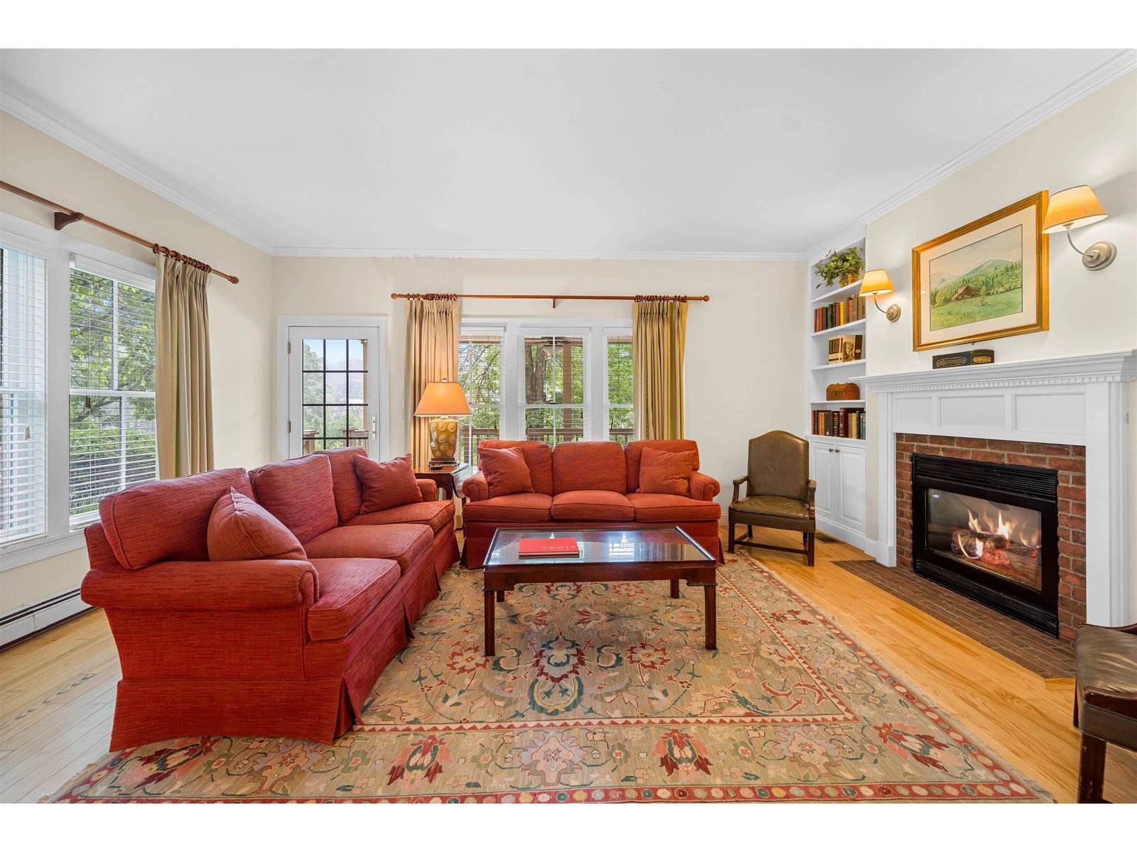 Living Room with Gas Fired Fieplace and Door to the Porch