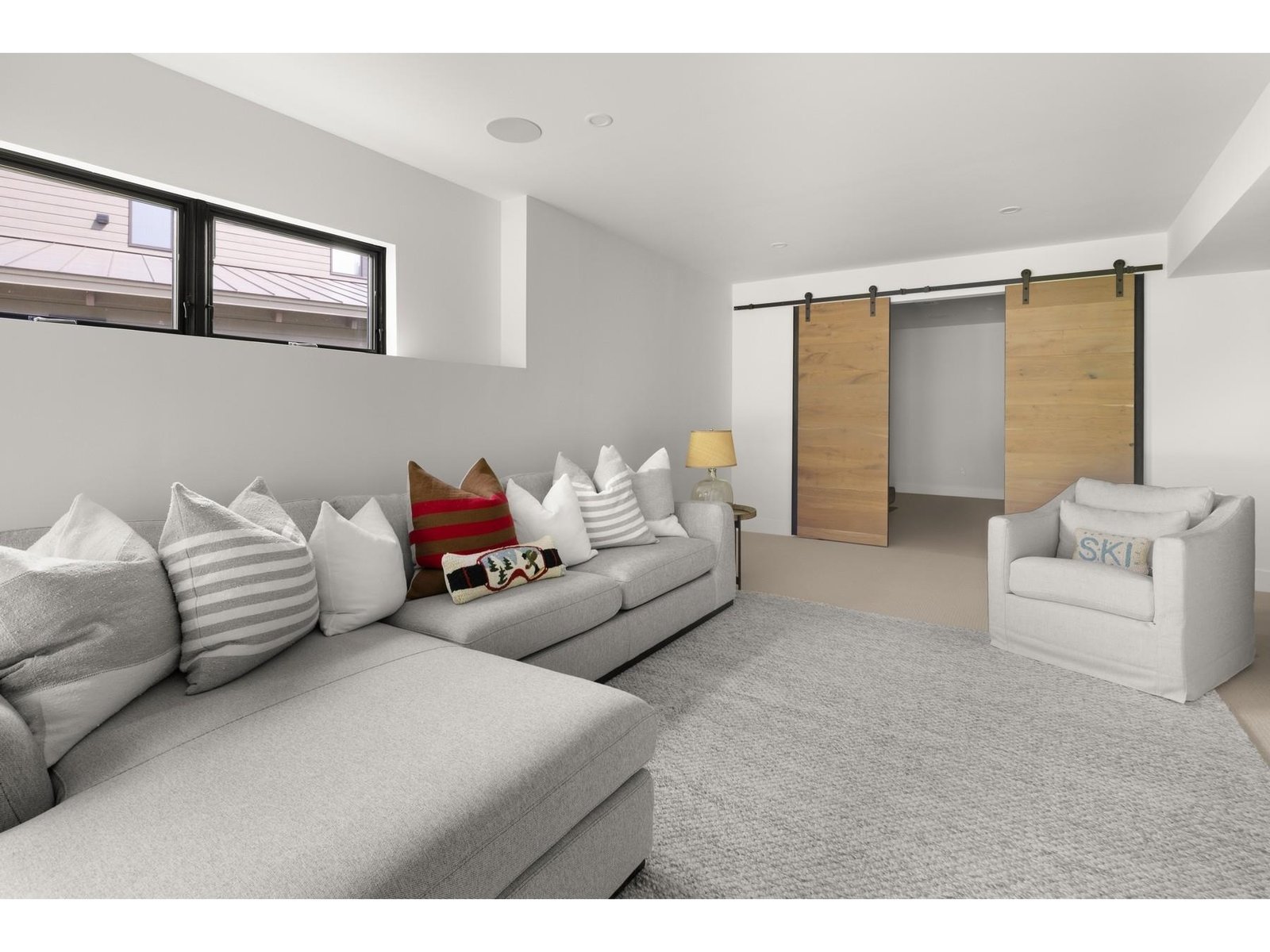 Lower level exerise room in the distance