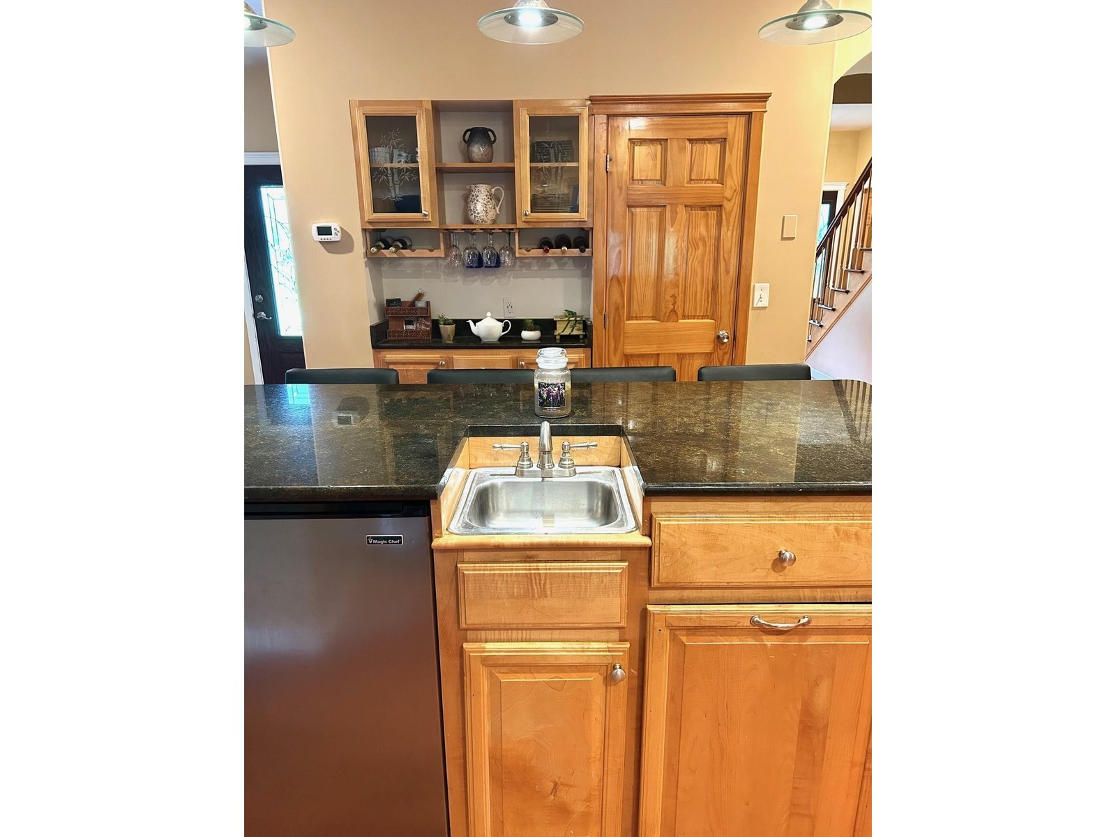 Bar includes vegtable sink.