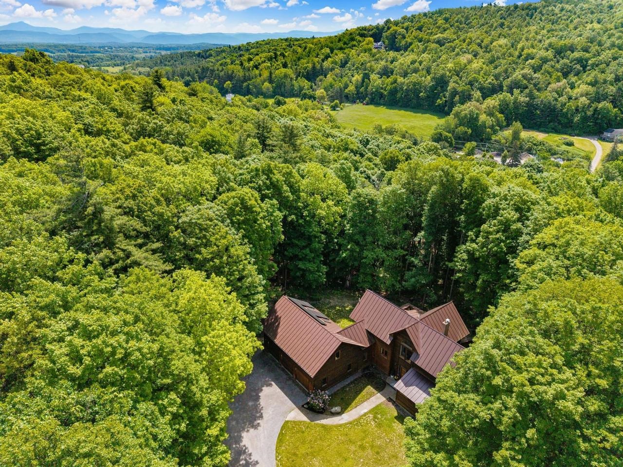 Set in serene wooded landscape