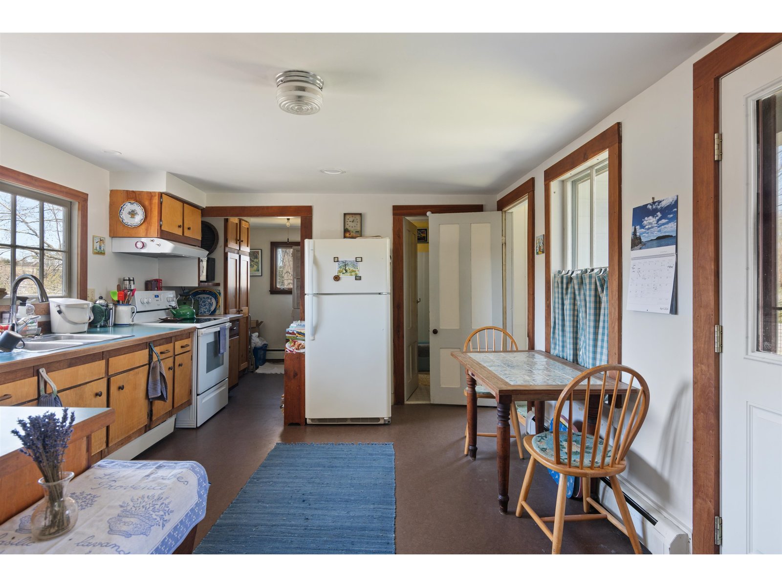 Large kitchen sensibly laid out with the laundry room at the north end