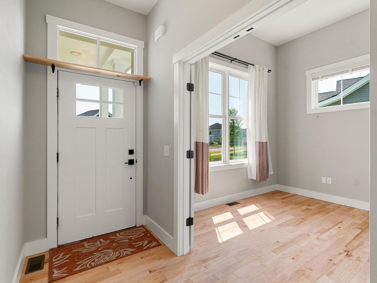 Entry with tall windows
