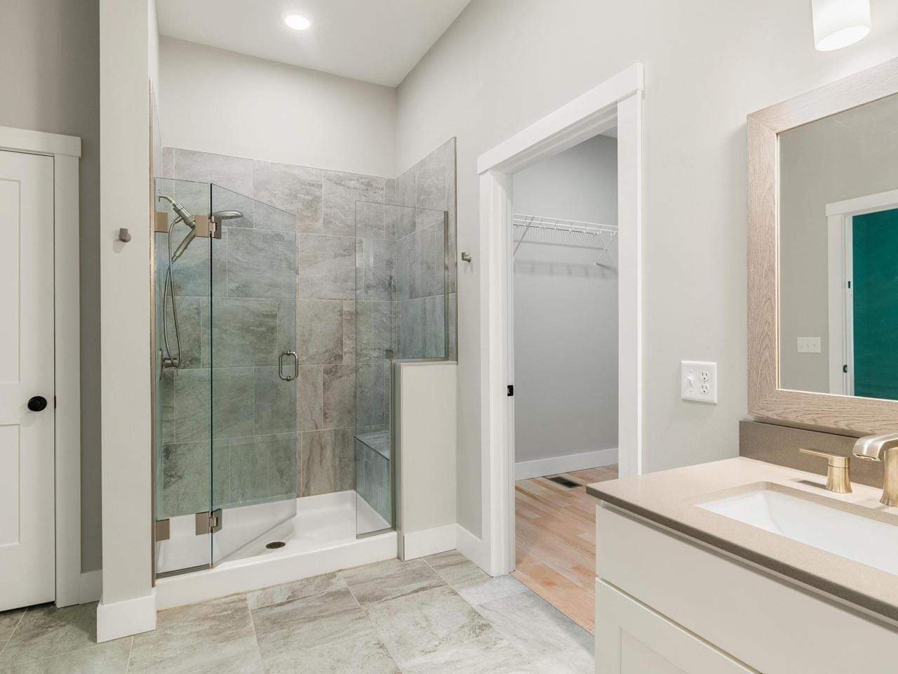Glass shower with tile walls