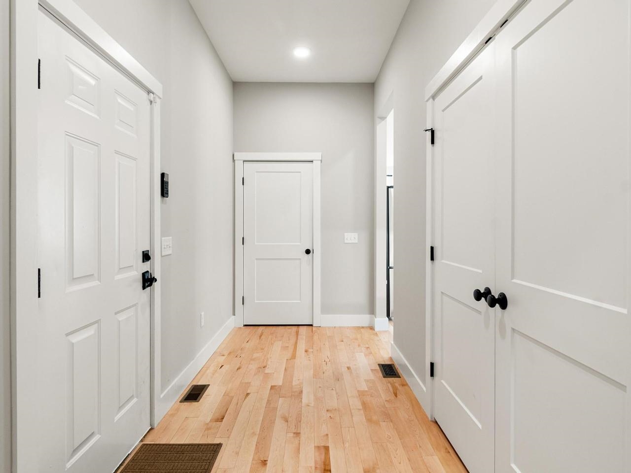 Hallway with light wood floor