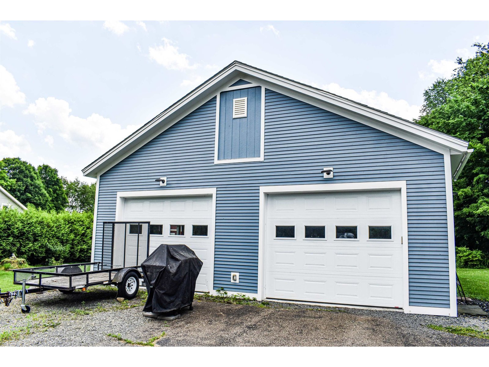 Oversized 2-car garage w/ heated exercise room