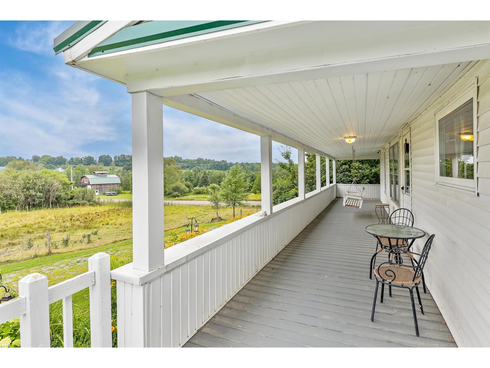 Sit on the two-sided covered porch to enjoy the view