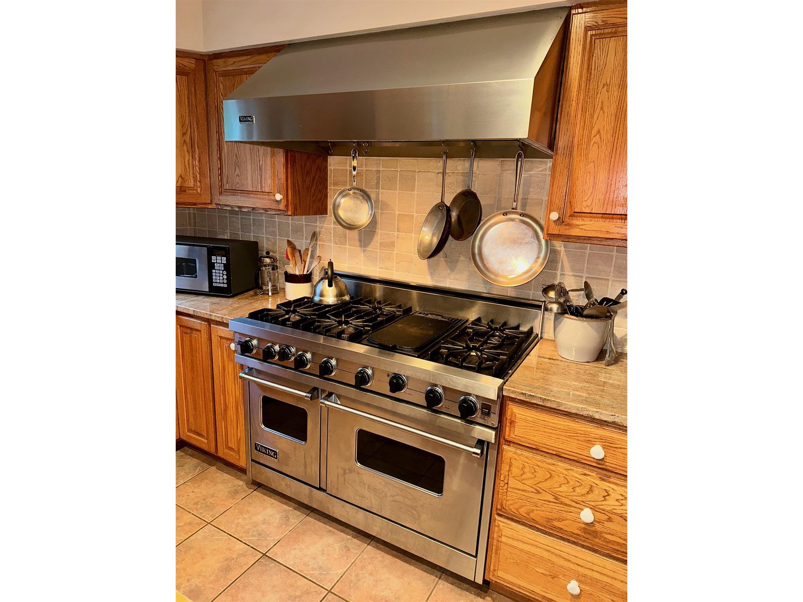 cooks kitchen with commercial range and butcher block counters