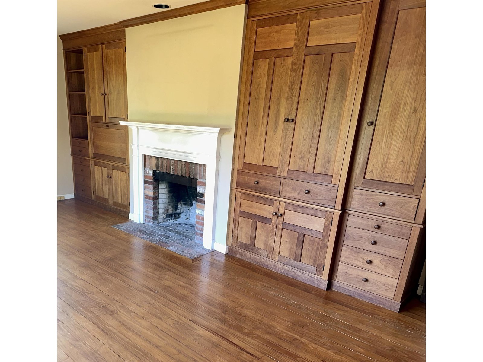 Beautiful cherry entertainment center with brick wood burning FP