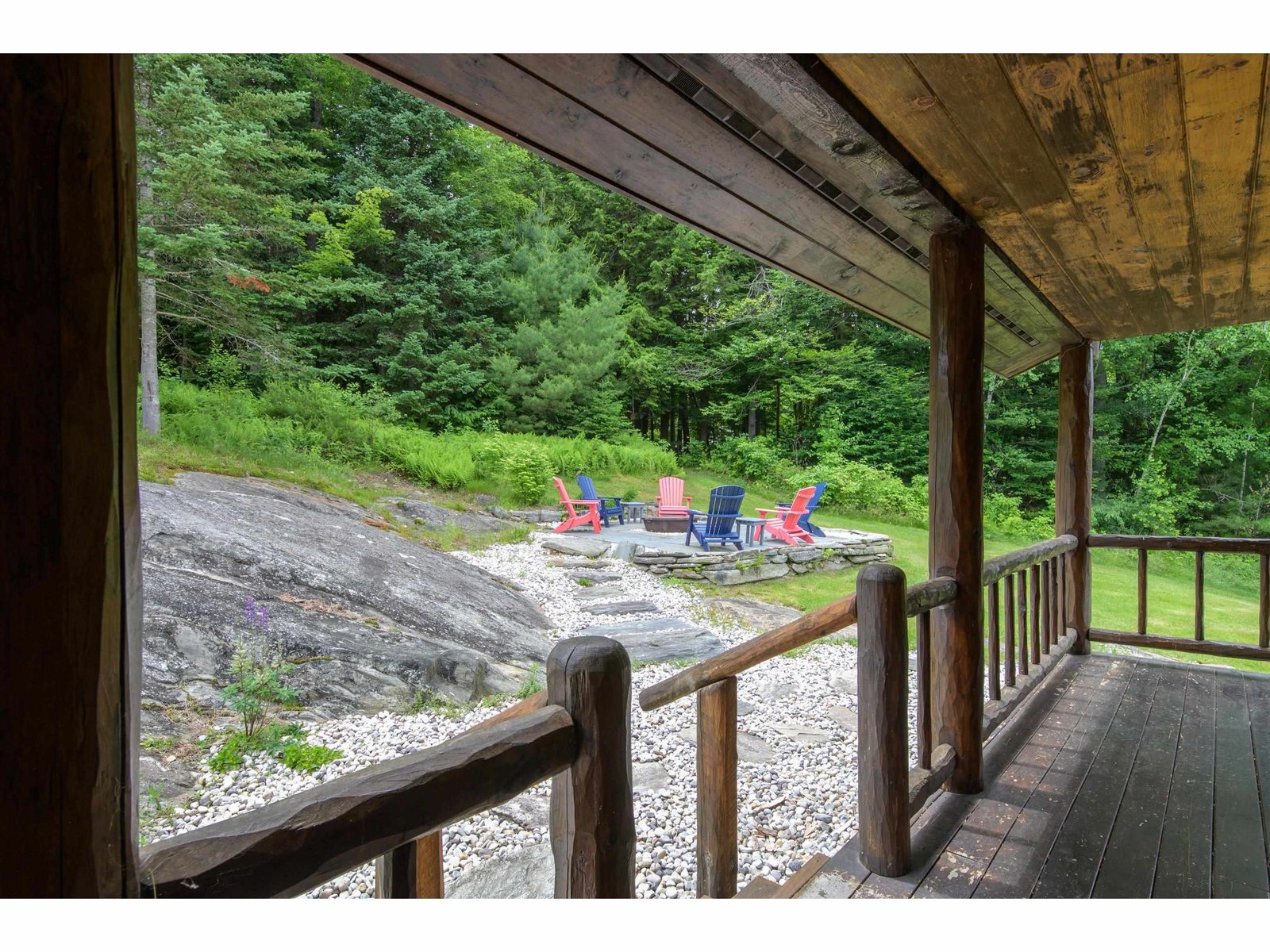 Covered back porch with access to patio/firepit...