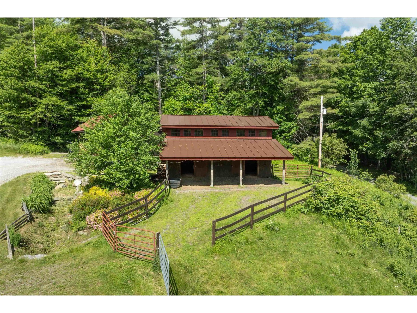 Three stall horse barn w/tackroom, hayloft & paddock...