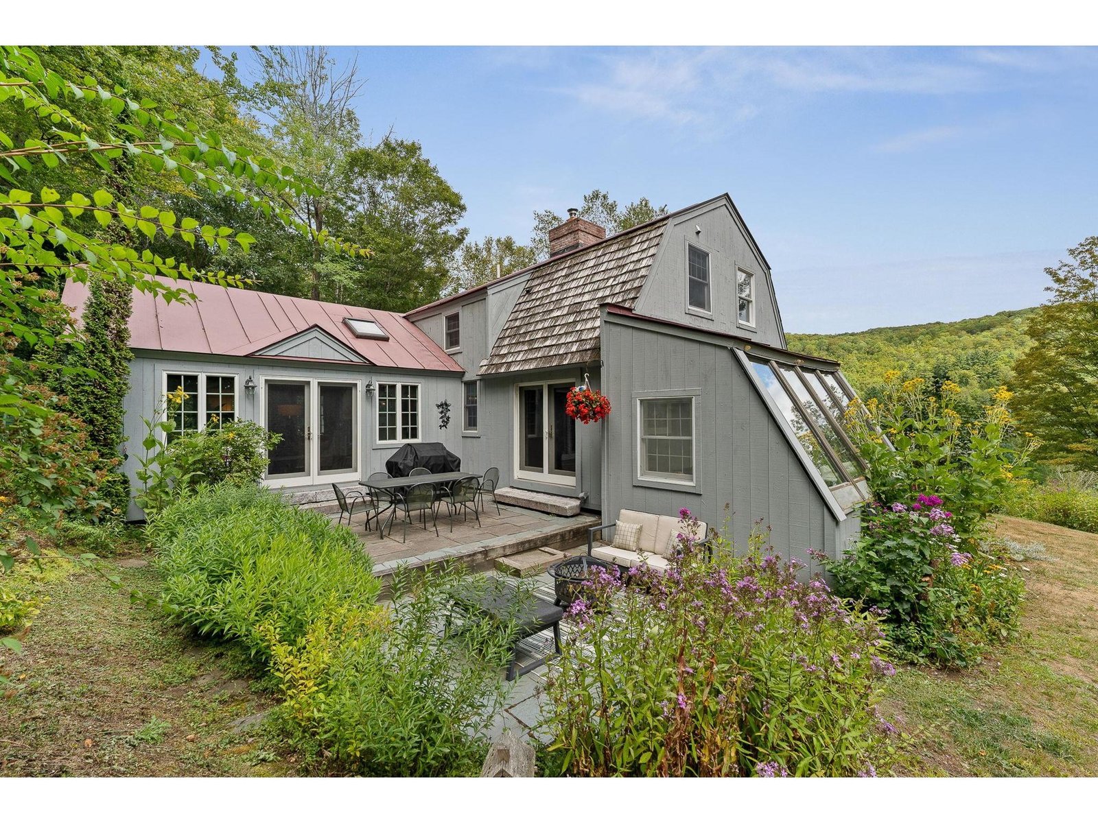 Gardens/patio & sunroom off westerly gable end